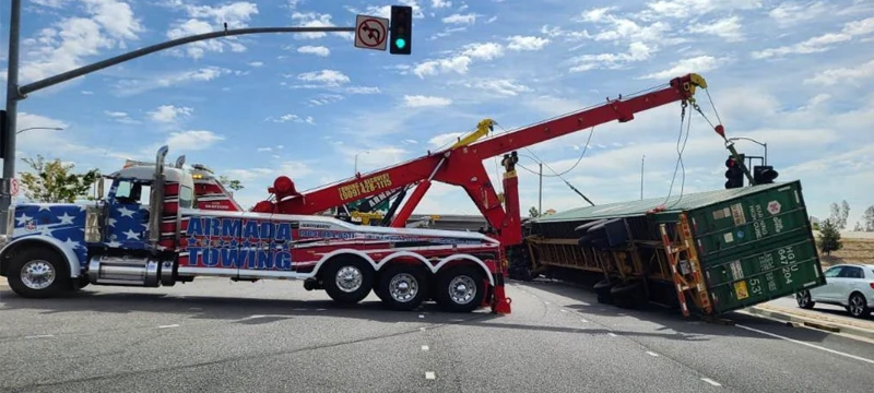Heavy-duty rotator recovering tipped shipping container