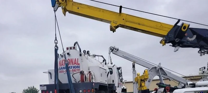Mobile crane lifting industrial tank equipment in Mustang Ridge TX