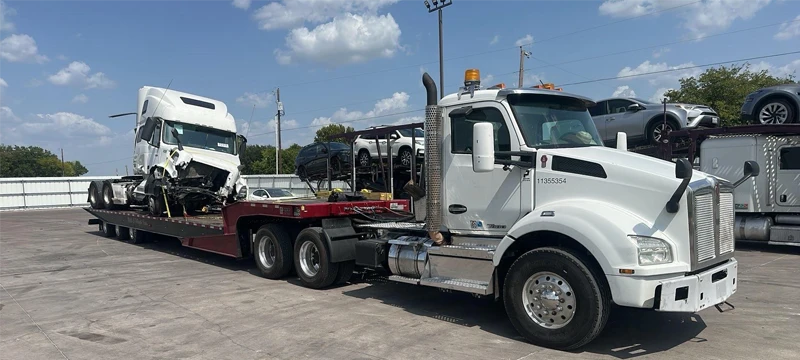 Heavy-duty haul unit transporting damaged semi tractors in Austin TX