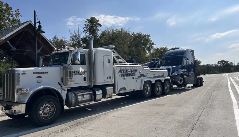 Armada Towing Austin TX heavy-duty wrecker towing semi truck