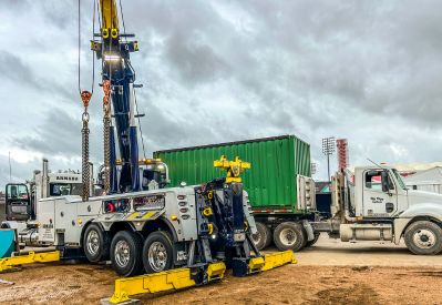 Armada Towing Service rotator lifting heavy cargo with extended boom