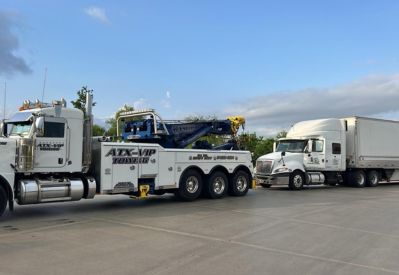 Armada Towing Service heavy-duty wrecker towing semi tractor-trailer