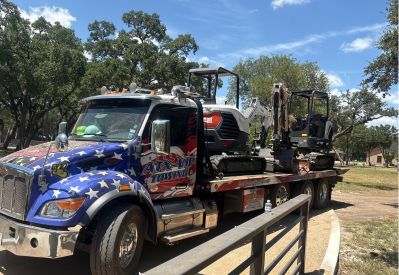Armada Towing Service transporting Bobcat mini excavator