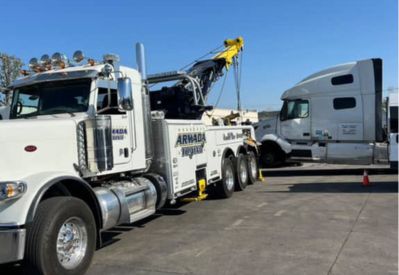 Armada Towing Service heavy wrecker decking semi-truck cabs